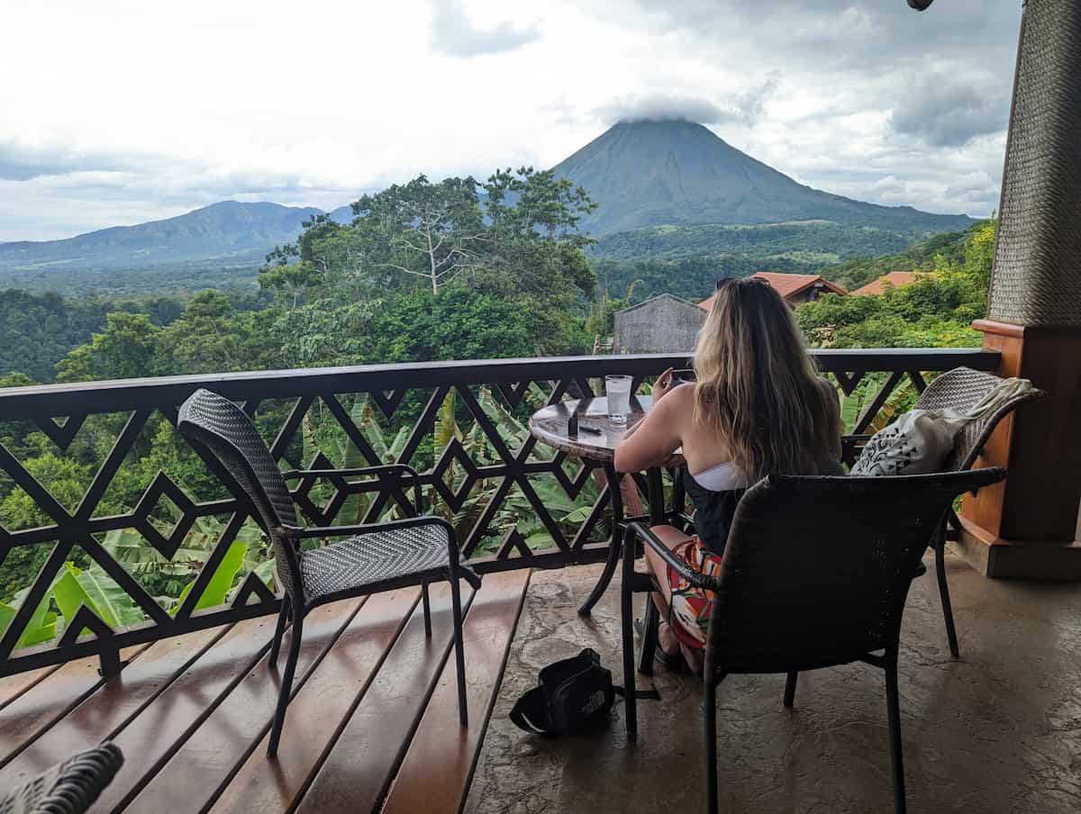 Cait Donahue, founder of 33 Esthetics, overlooking a volcano in Costa Rica